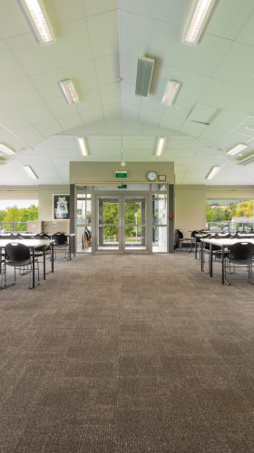 Saxton Hockey Clubroom empty room with tables and chairs
